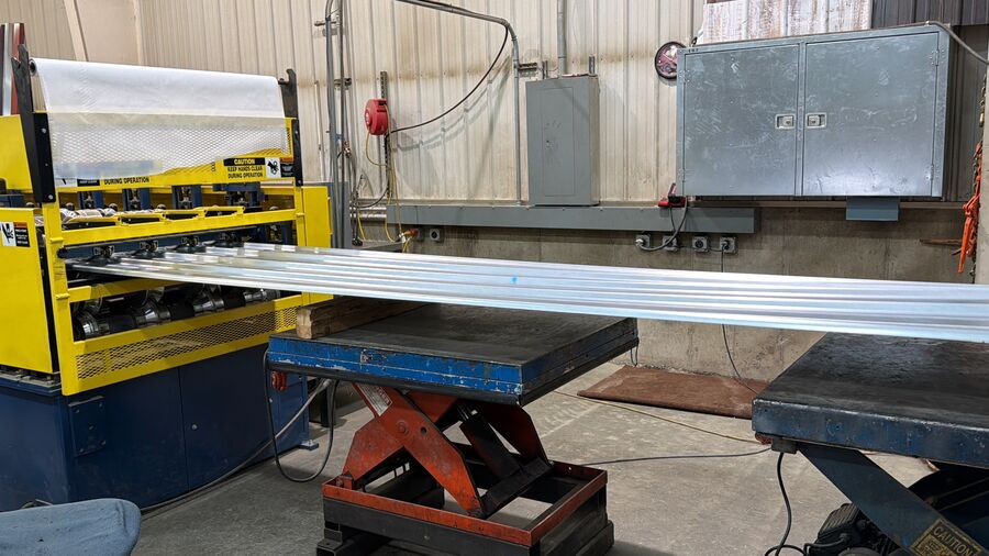 A finished panel comes off the roll-former — Valley Steel & Trim, Carpenter SD